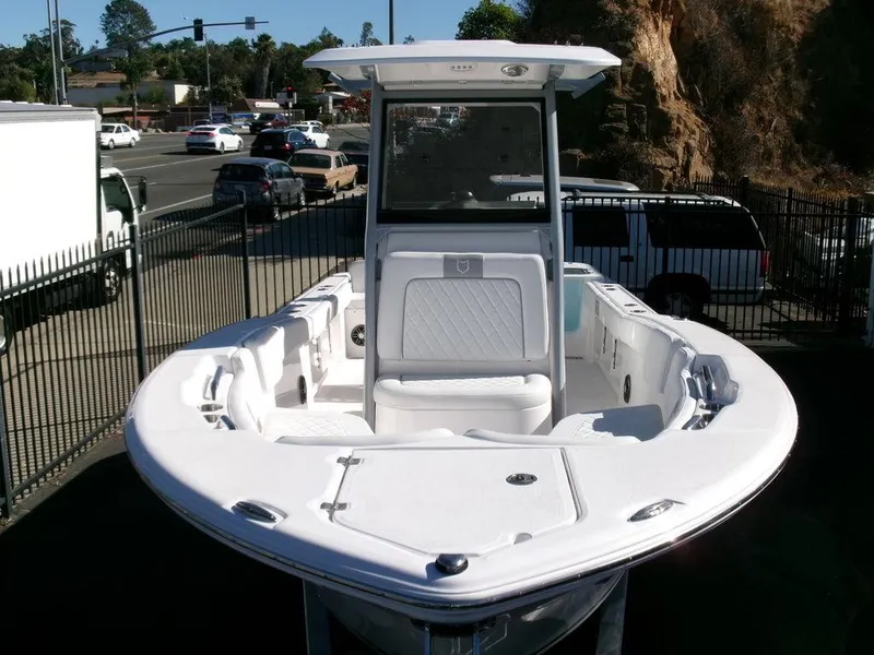 Slide: The Image of 2025 Sea Fox 248 Commander boat, white exterior, parked outdoors near a road. - 38