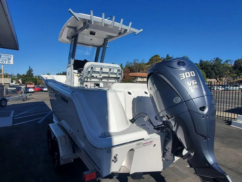 Slide: The Image of 2025 Sea Fox 248 Commander boat with powerful 300 V6 engine, parked outdoors. - 4