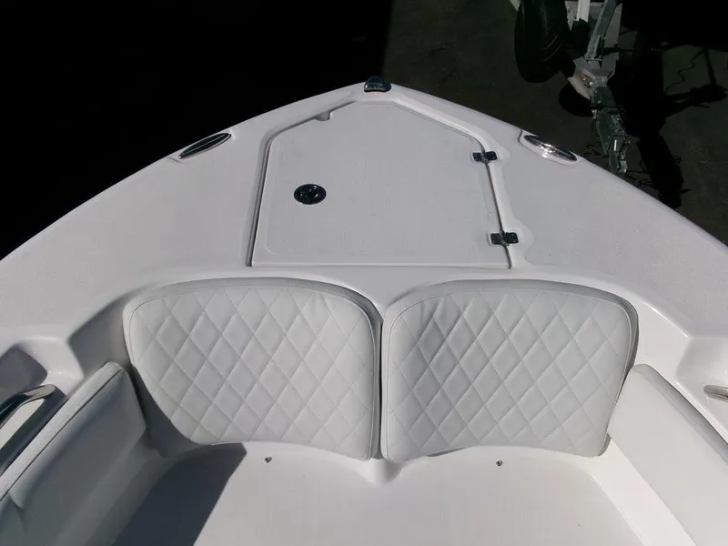Slide: The Image of 2025 Sea Fox 248 Commander boat bow with cushioned seating and storage hatch. - 5
