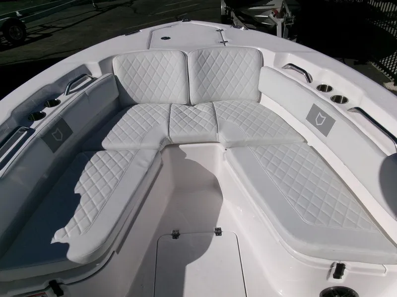 Slide: The Image of 2025 Sea Fox 248 Commander boat with white cushioned seating in the bow area. - 7