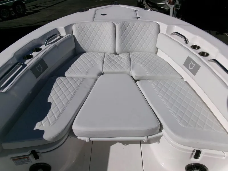 Slide: The Image of 2025 Sea Fox 248 Commander boat with white cushioned seating area. - 9