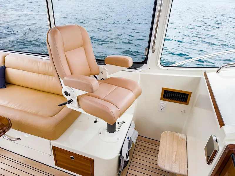 Slide: The Image of 2012 MJM 40z Downeast interior with tan leather seating and ocean view. - 13