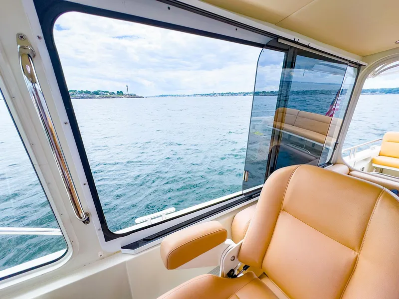 Slide: The Image of Interior view of 2012 MJM 40z Downeast boat with ocean scenery through window. - 14