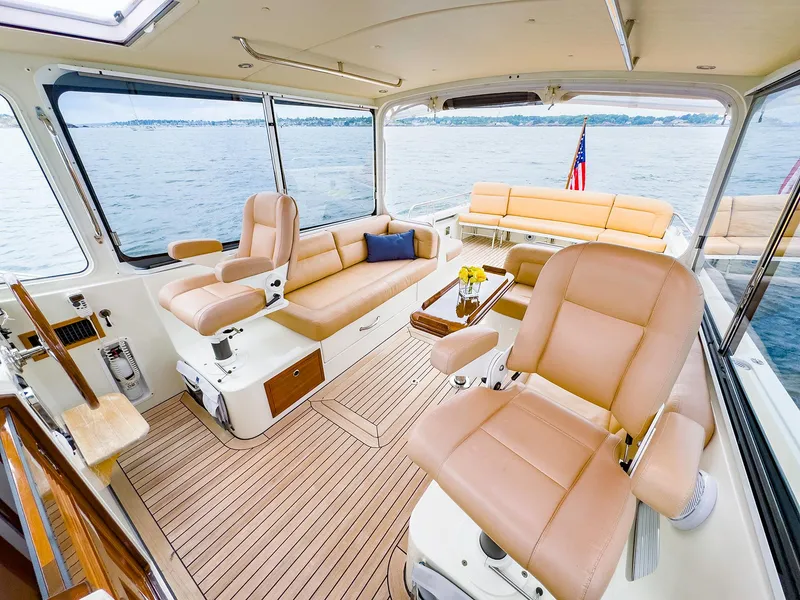 Slide: The Image of Luxurious interior of 2012 MJM 40z Downeast yacht with plush seating and scenic ocean view. - 15