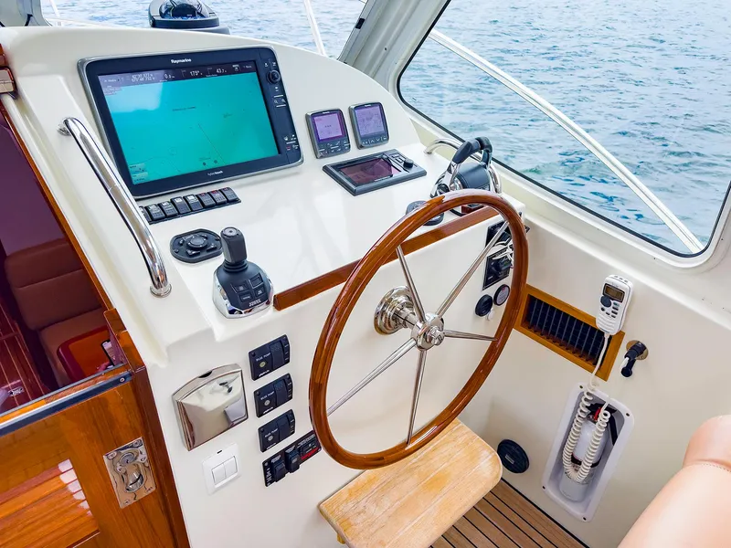 Slide: The Image of Helm of 2012 MJM 40z Downeast boat with navigation equipment and wooden steering wheel. - 18