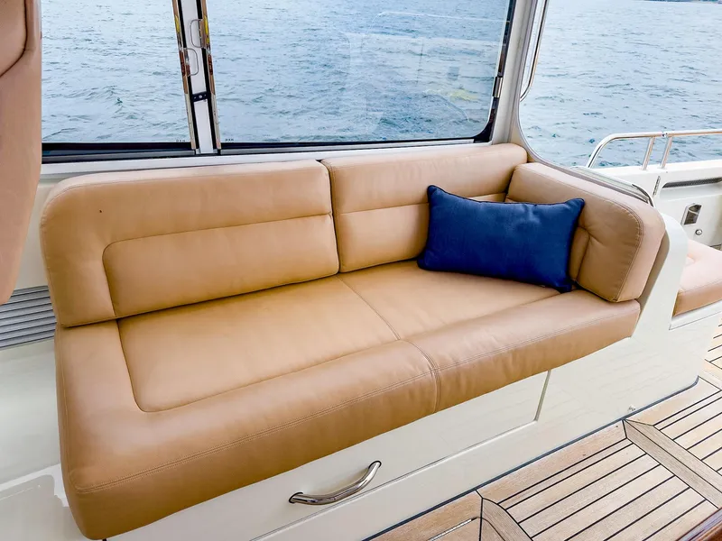 Slide: The Image of Luxurious tan leather seating on 2012 MJM 40z Downeast yacht with blue cushion. - 19