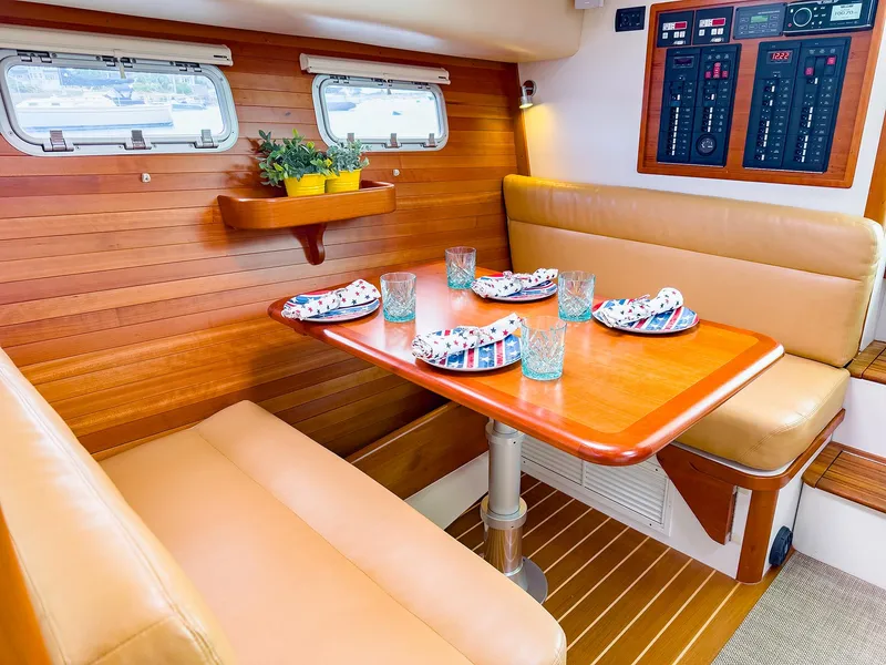 Slide: The Image of Interior of 2012 MJM 40z Downeast yacht with dining area and wooden accents. - 21