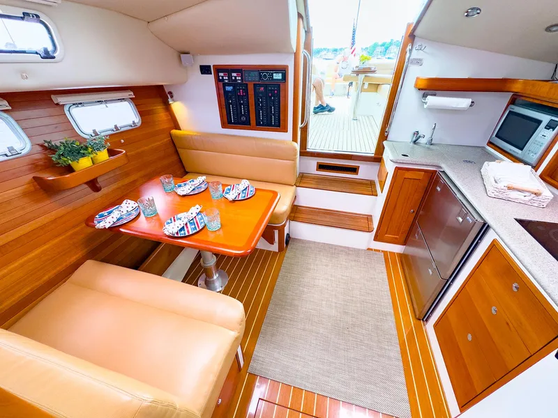 Slide: The Image of Interior of 2012 MJM 40z Downeast yacht with dining area and kitchenette. - 23