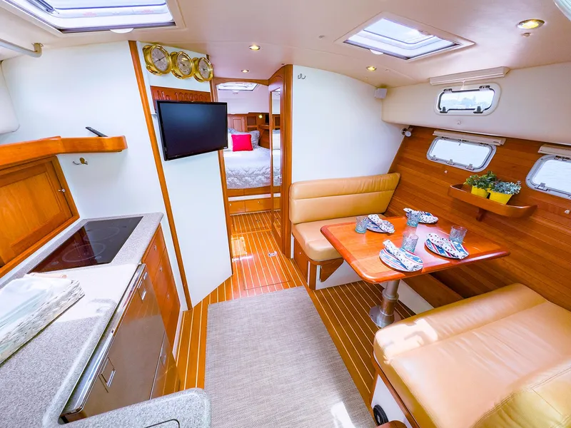 Slide: The Image of Luxurious interior of 2012 MJM 40z Downeast yacht with dining area and kitchenette. - 24