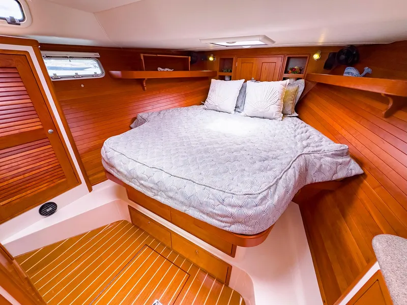 Slide: The Image of 2012 MJM 40z Downeast cabin with cozy bed and wooden interior. - 33