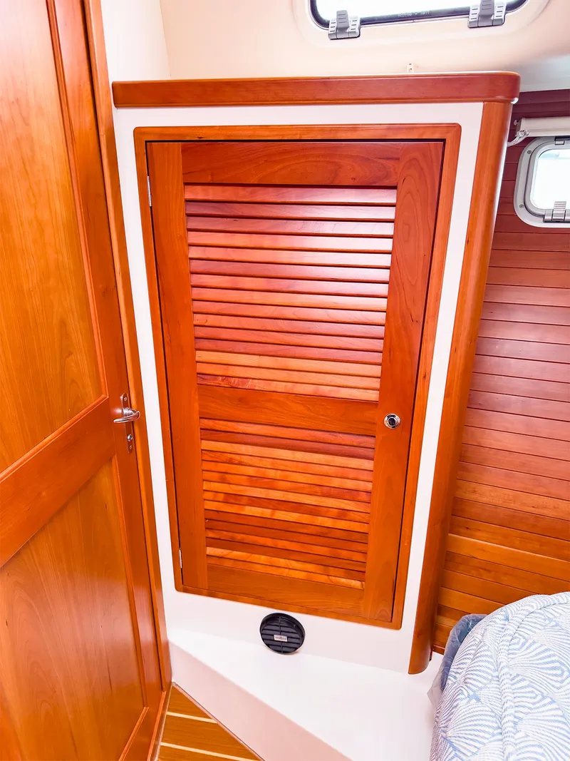 Slide: The Image of Wooden cabinet door inside 2012 MJM 40z Downeast boat cabin interior. - 36