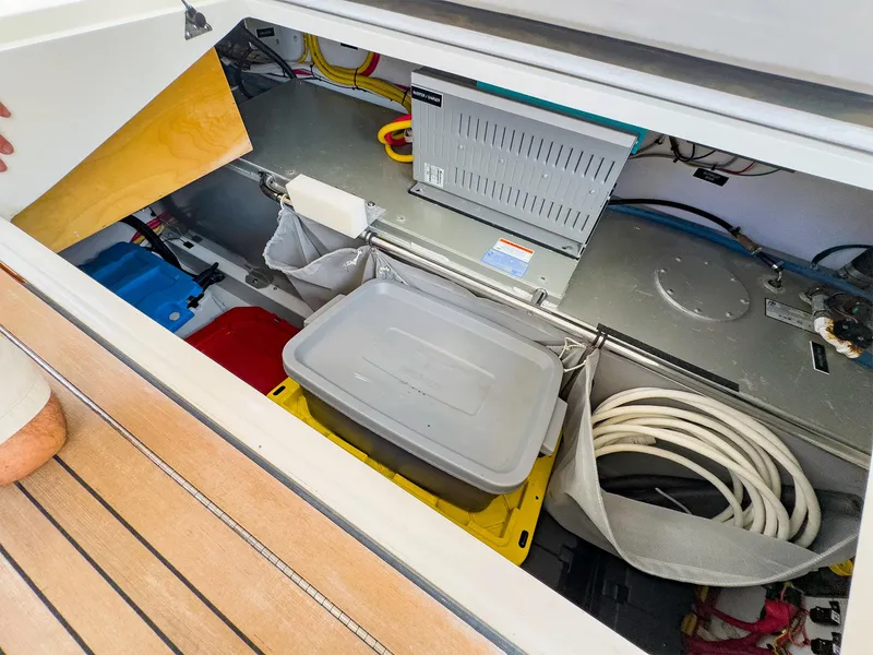 Slide: The Image of Storage compartment of 2012 MJM 40z Downeast boat, featuring organized equipment and cables. - 42