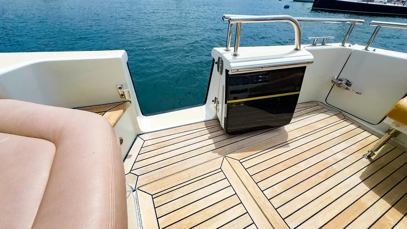 Slide: The Image of 2012 MJM 40z Downeast boat deck with teak flooring and seating, overlooking the water. - 7