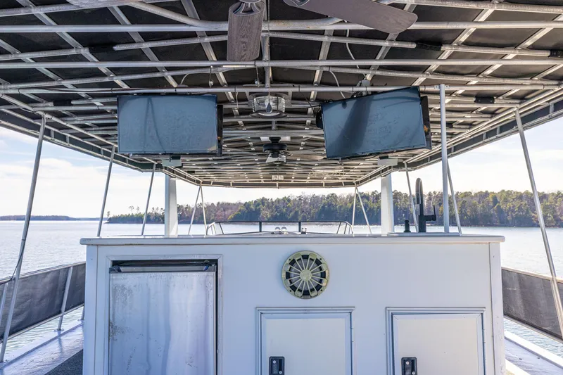 Slide: The Image of 1998 Stardust Cruisers Custom Luxury Houseboat with rooftop deck and scenic lake view. - 22