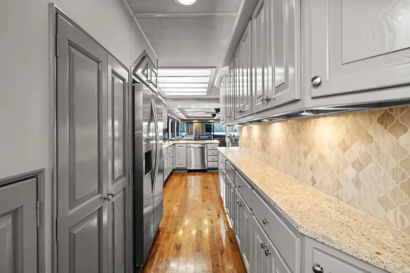 Slide: The Image of Luxurious bedroom interior of 1998 Stardust Cruisers houseboat with elegant decor and ceiling fan. - 33