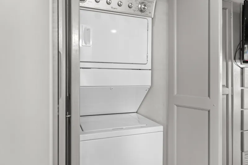 Slide: The Image of Stacked washer and dryer in 1998 Stardust Cruisers Custom Luxury Houseboat. - 36