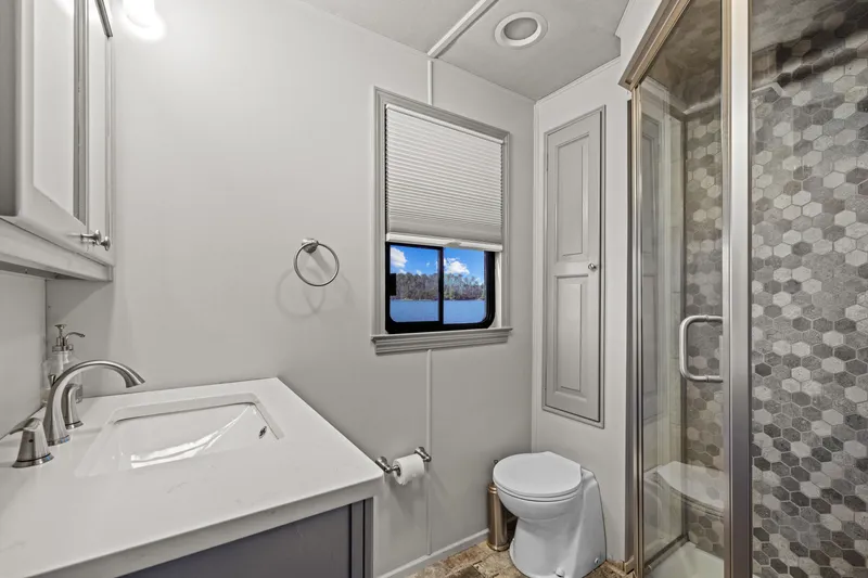 Slide: The Image of Luxurious 1998 Stardust Cruisers houseboat interior with modern kitchen and lake view. - 37