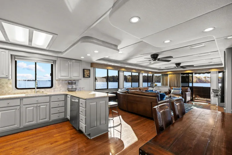 Slide: The Image of Luxurious 1998 Stardust Cruisers houseboat interior with modern kitchen and spacious living area. - 41