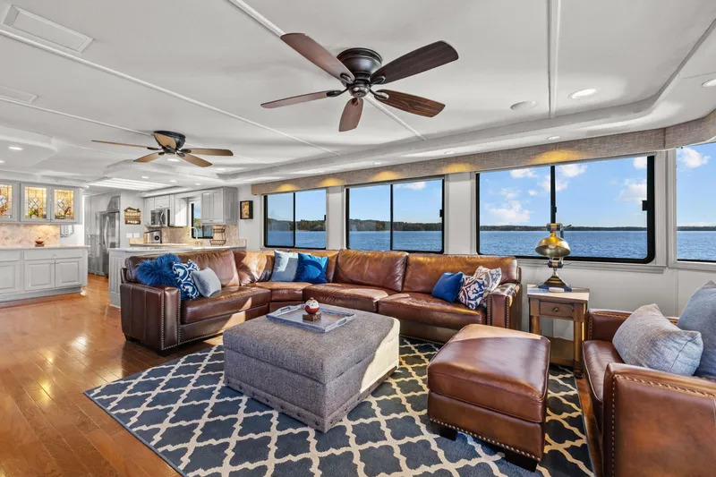 Slide: The Image of Luxurious 1998 Stardust Cruisers houseboat interior with leather seating, large windows, and modern amenities. - 43