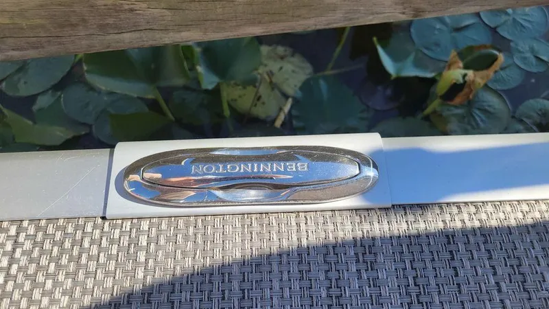 Slide: The Image of Bennington 24 RTFBC boat detail with water and lily pads in the background. - 10
