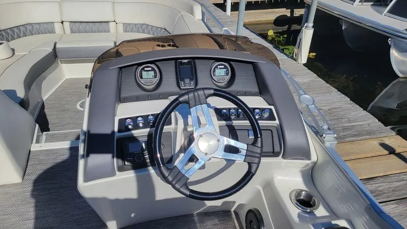 Slide: The Image of 2020 Bennington 24 RTFBC boat dashboard with steering wheel and gauges. - 3