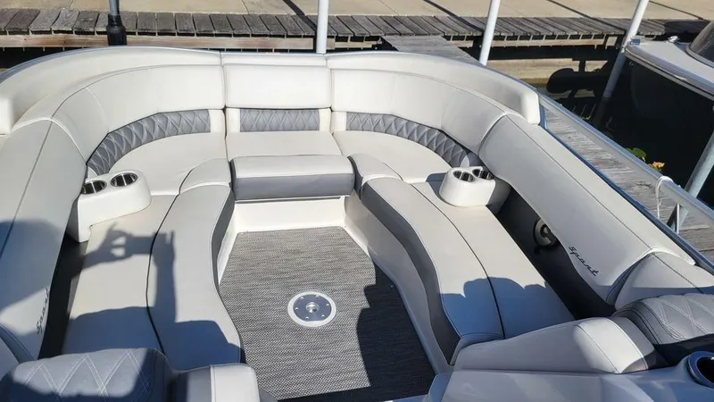 Slide: The Image of 2020 Bennington 24 RTFBC boat interior with plush seating and cup holders. - 6