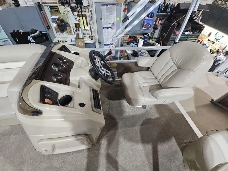 Slide: The Image of 2012 Bennington 20SL boat interior with steering wheel and captain's chair. - 10