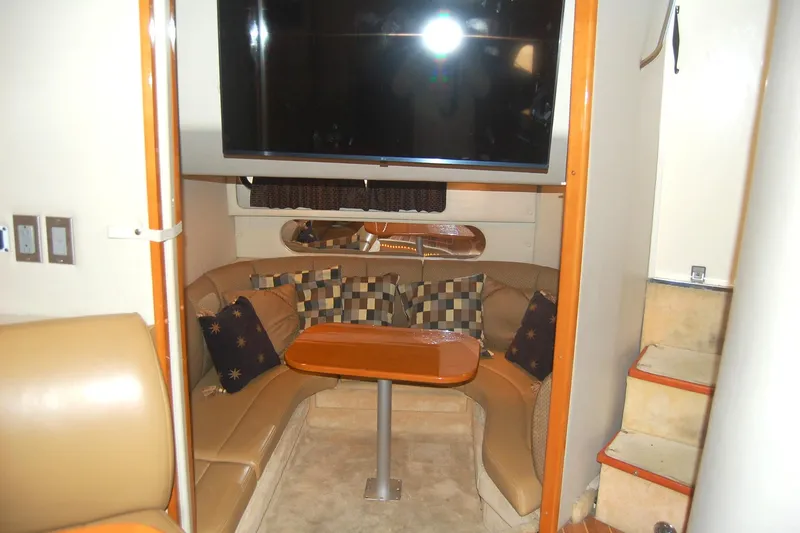 Slide: The Image of Interior of 2006 Chaparral Signature 350 yacht with cozy seating and table. - 20