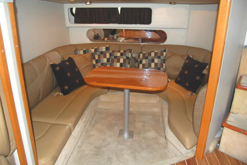Slide: The Image of 2006 Chaparral Signature 350 interior with cozy seating and wooden table. - 21