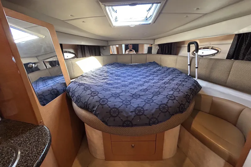 Slide: The Image of 2006 Chaparral Signature 350 cabin with bed, skylight, and seating area. - 28