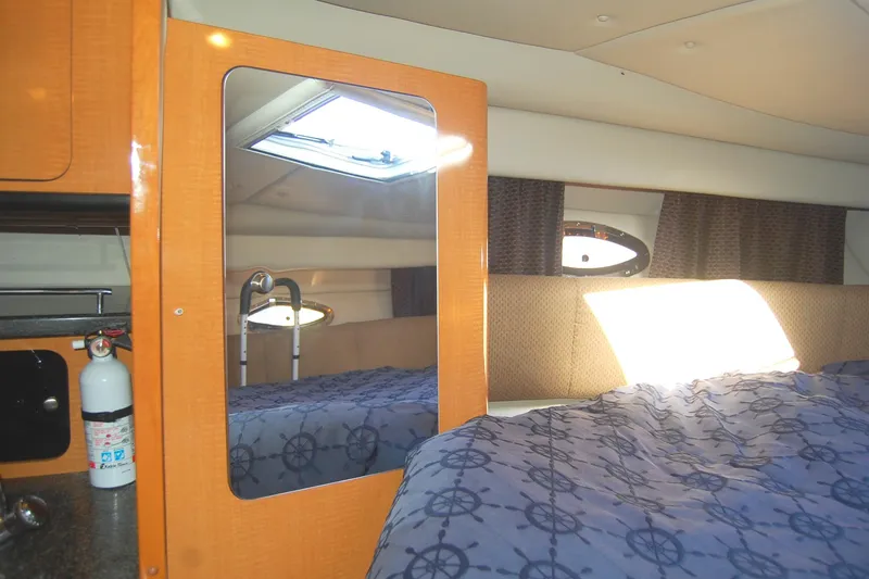 Slide: The Image of Interior cabin of 2006 Chaparral Signature 350 with bed, mirror, and window. - 29