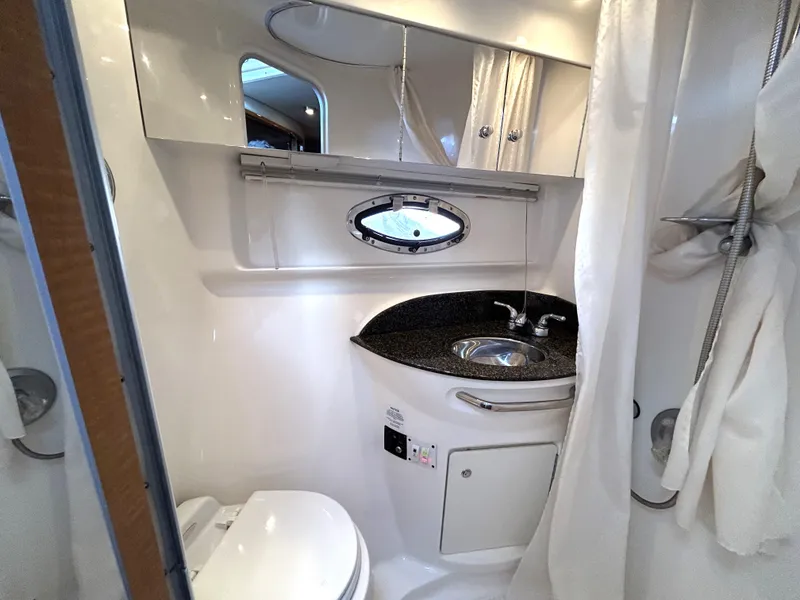 Slide: The Image of 2006 Chaparral Signature 350 bathroom with sink, toilet, and shower. - 31