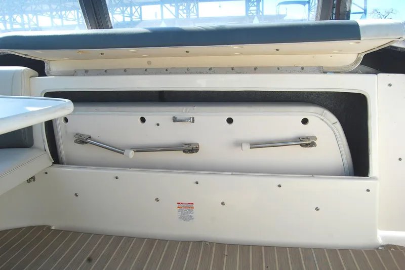 Slide: The Image of 2006 Chaparral Signature 350 boat interior storage compartment with open hatch. - 37