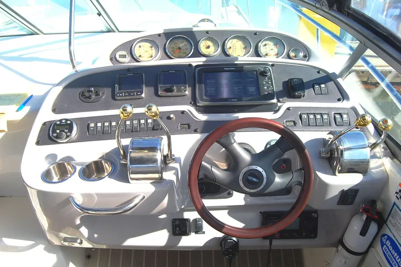 Slide: The Image of Cockpit of 2006 Chaparral Signature 350 with steering wheel and control panel. - 39