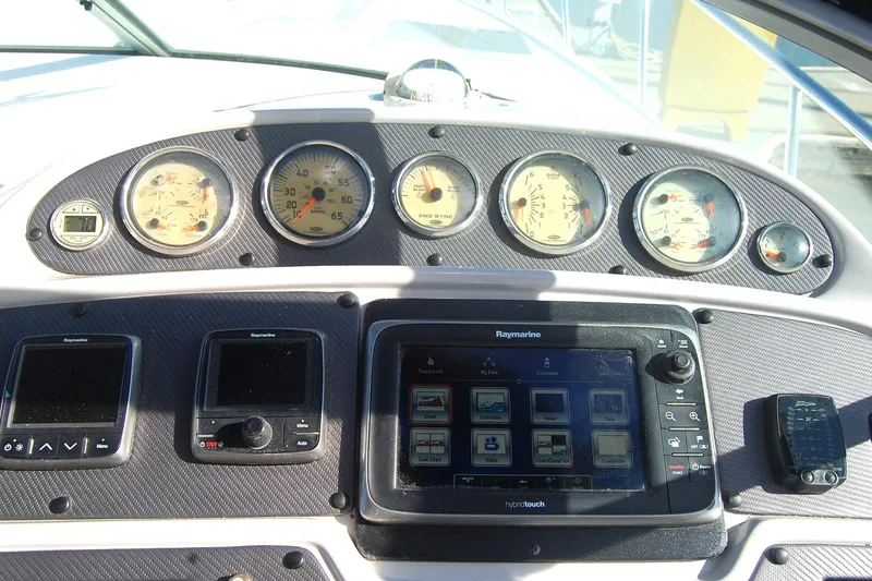 Slide: The Image of Dashboard of 2006 Chaparral Signature 350 with gauges and navigation system. - 40