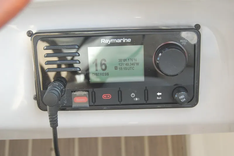 Slide: The Image of Raymarine marine radio on 2006 Chaparral Signature 350, displaying distress channel 16. - 44