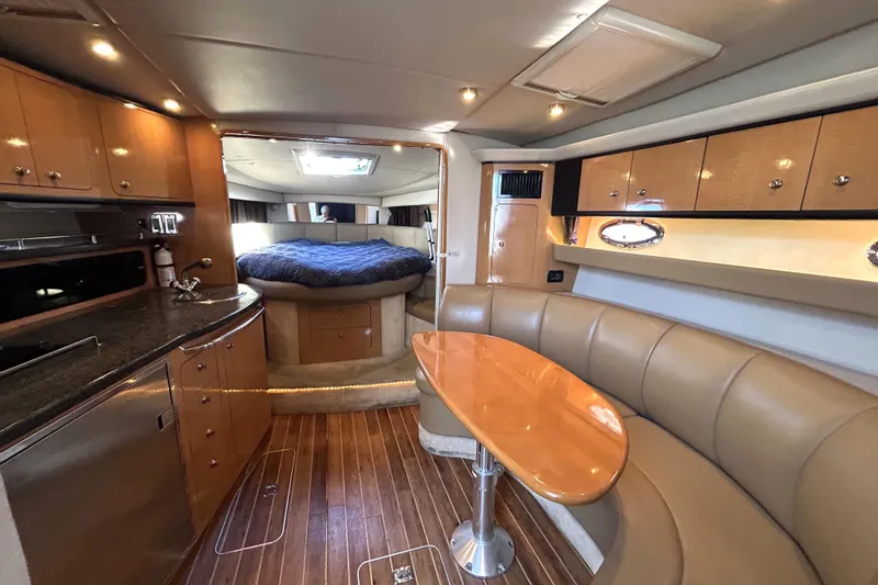 Slide: The Image of Luxurious interior of 2006 Chaparral Signature 350 yacht with wood flooring and cozy seating. - 7