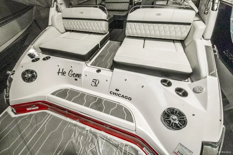 Slide: The Image of 2021 Regal 2800 Bowrider boat interior with white seating and custom text "He Gone" and "Chicago". - 16