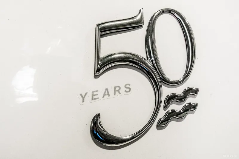 Slide: The Image of "50 Years" emblem on 2021 Regal 2800 Bowrider boat. - 19