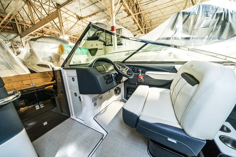 Slide: The Image of 2021 Regal 2800 Bowrider interior with modern dashboard and comfortable seating. - 20