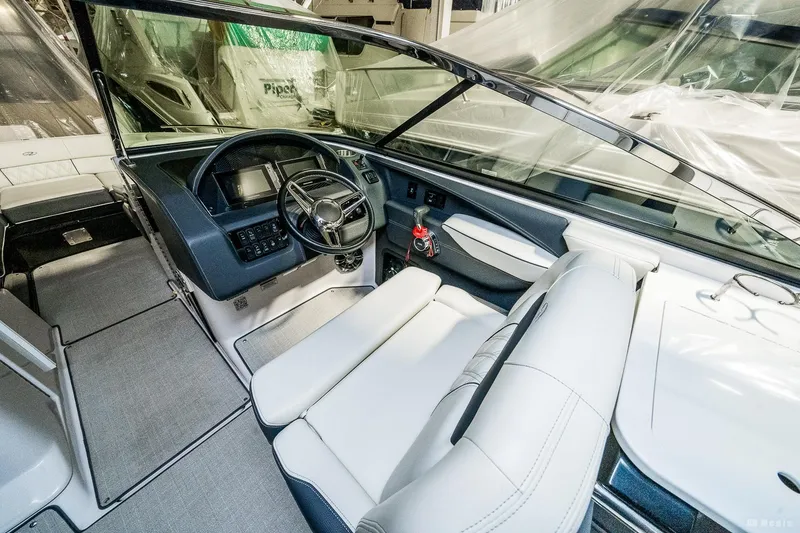 Slide: The Image of 2021 Regal 2800 Bowrider interior with modern dashboard and comfortable seating. - 22