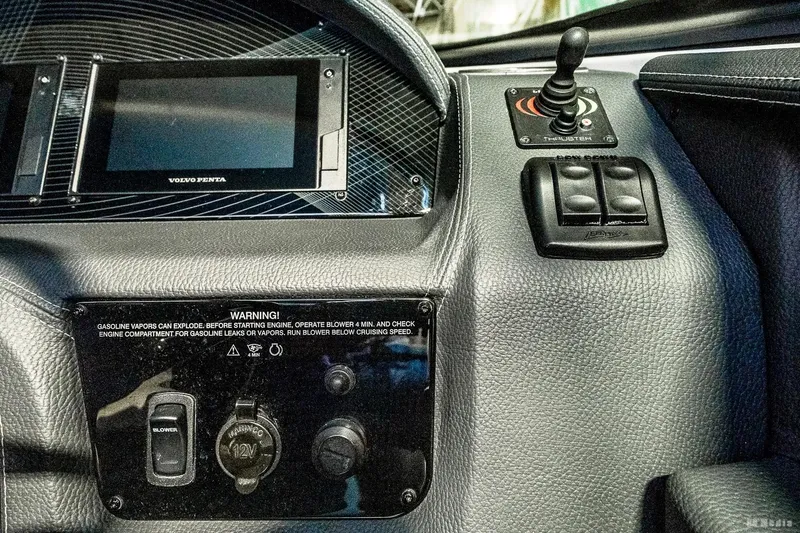 Slide: The Image of Dashboard of 2021 Regal 2800 Bowrider boat with control panel and display. - 26