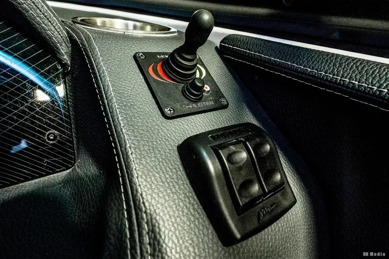 Slide: The Image of Control panel of 2021 Regal 2800 Bowrider boat with joystick and switches. - 29