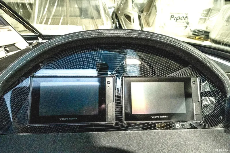 Slide: The Image of Dashboard of 2021 Regal 2800 Bowrider with dual Volvo Penta displays. - 30