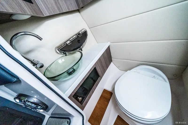 Slide: The Image of 2021 Regal 2800 Bowrider bathroom with modern sink and toilet. - 48