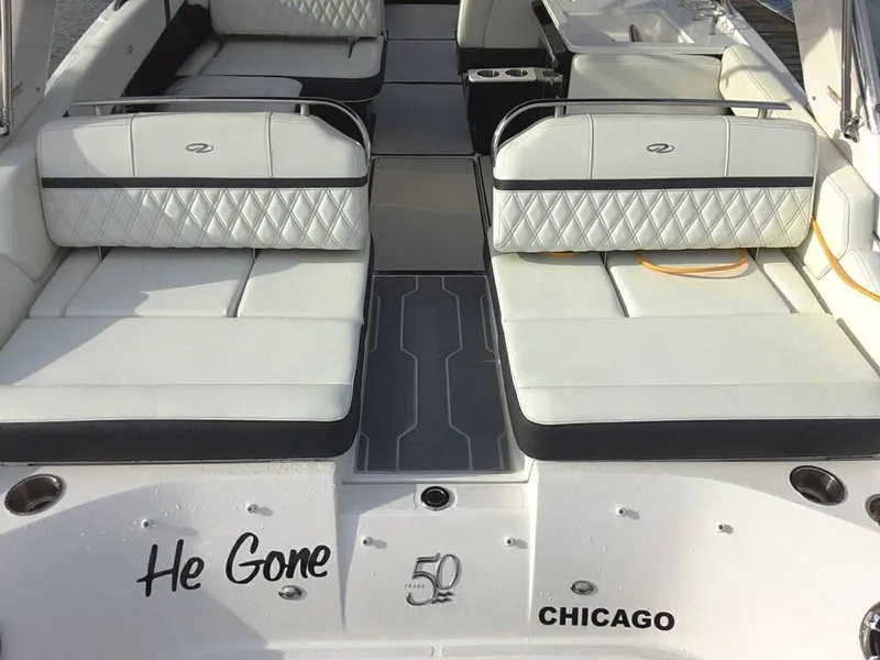 Slide: The Image of 2021 Regal 2800 Bowrider boat interior with white seating, "He Gone" text, Chicago location. - 7