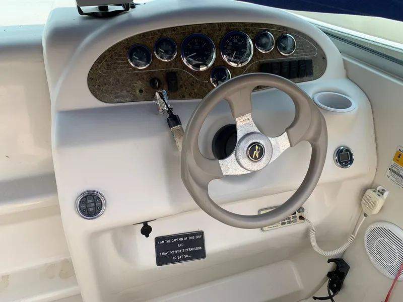Slide: The Image of Steering console of a 2000 Sea Ray 215 Express Cruiser with gauges and controls. - 5