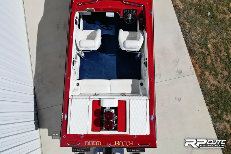 Slide: The Image of Overhead view of a 1998 Warlock 28 SXT boat with red and white interior. - 16