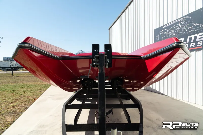 Slide: The Image of 1998 Warlock 28 SXT boat, red hull, on trailer at RP Elite Motors & Marine. - 29