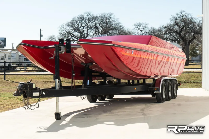 Slide: The Image of Red 1998 Warlock 28 SXT powerboat on trailer, parked outdoors. - 3